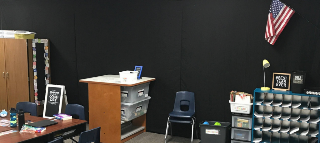 Decluttered classroom with black walls