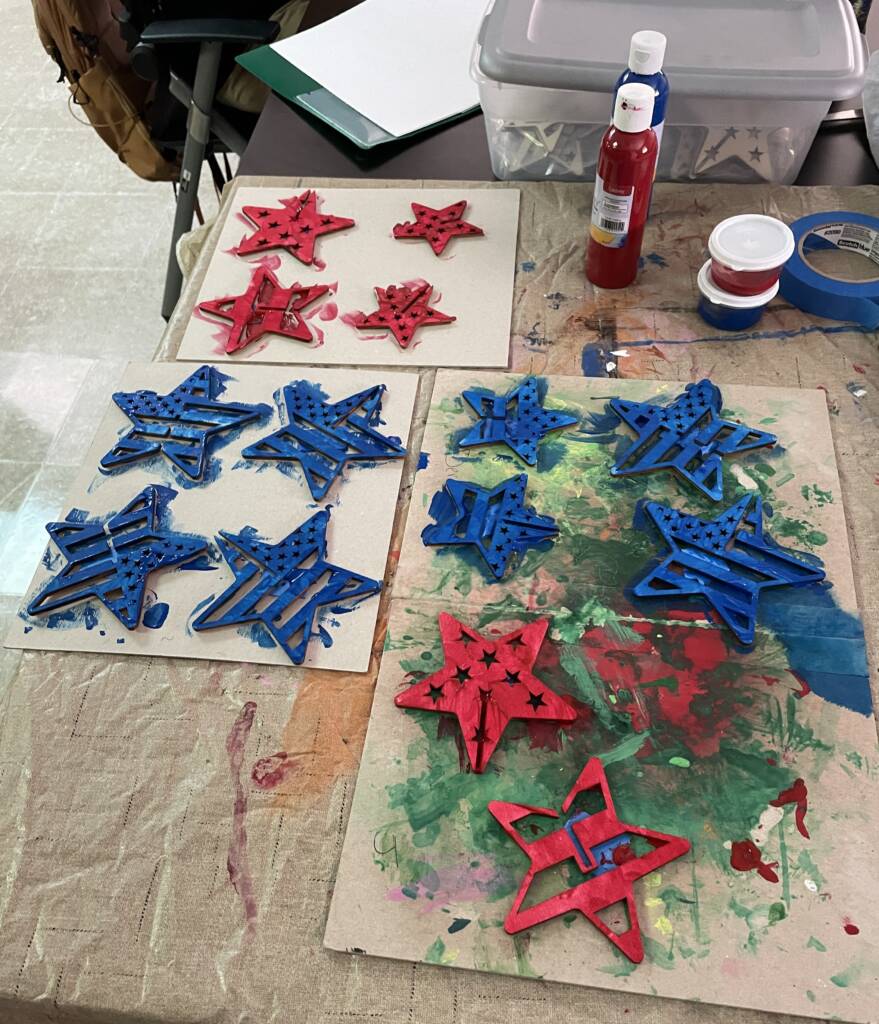 Painted wooden red, white, and blue stars