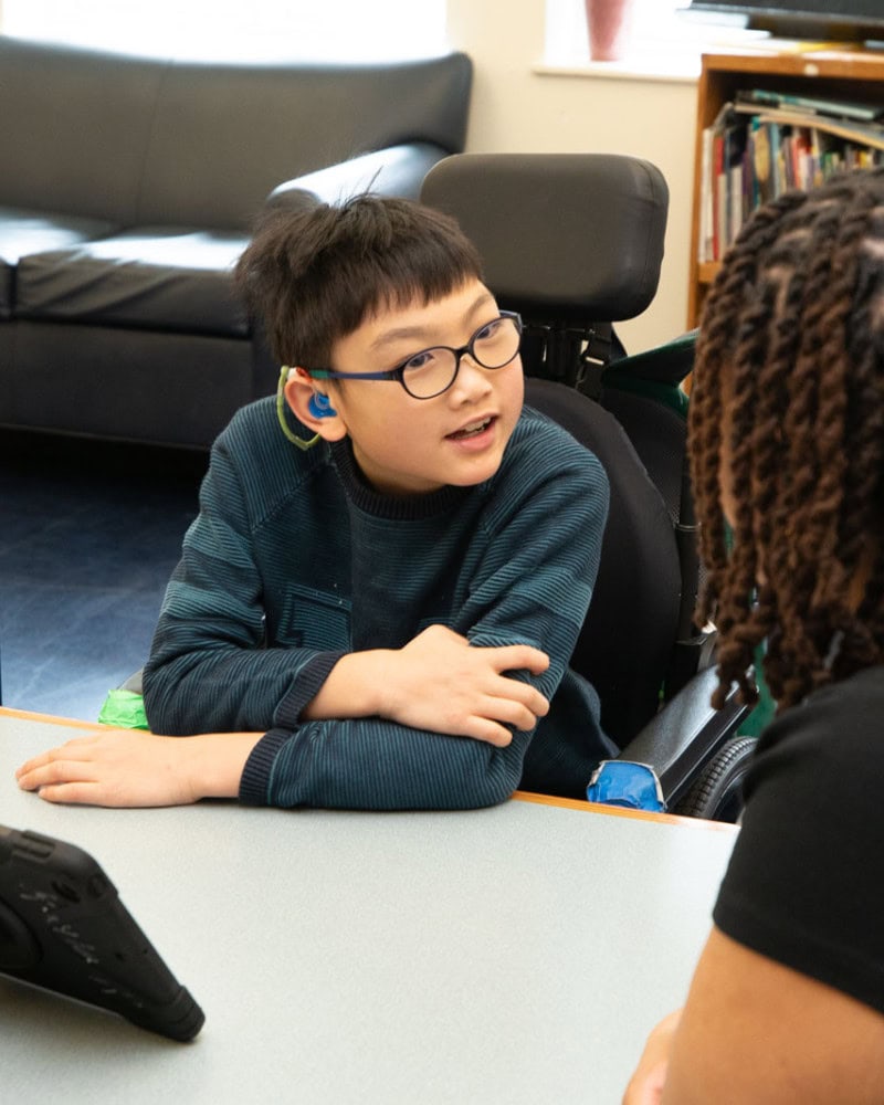 Student talking to a teacher