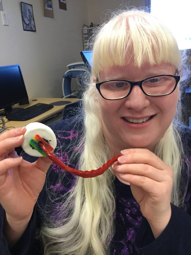 Teacher, Kathi Garza, holding the completed candy eyeball. 