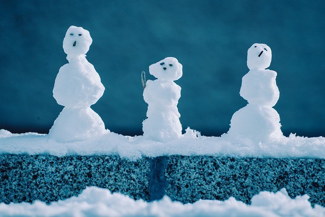 Three little snowman in a row