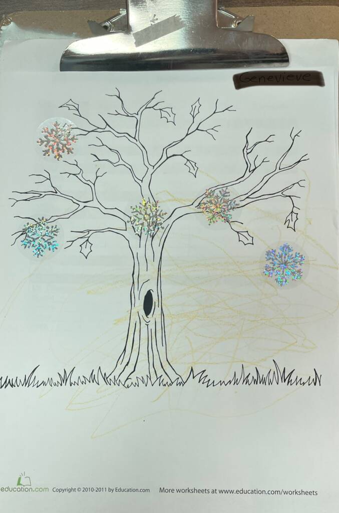 Finished tree paper that is colored and has glitter stickers.